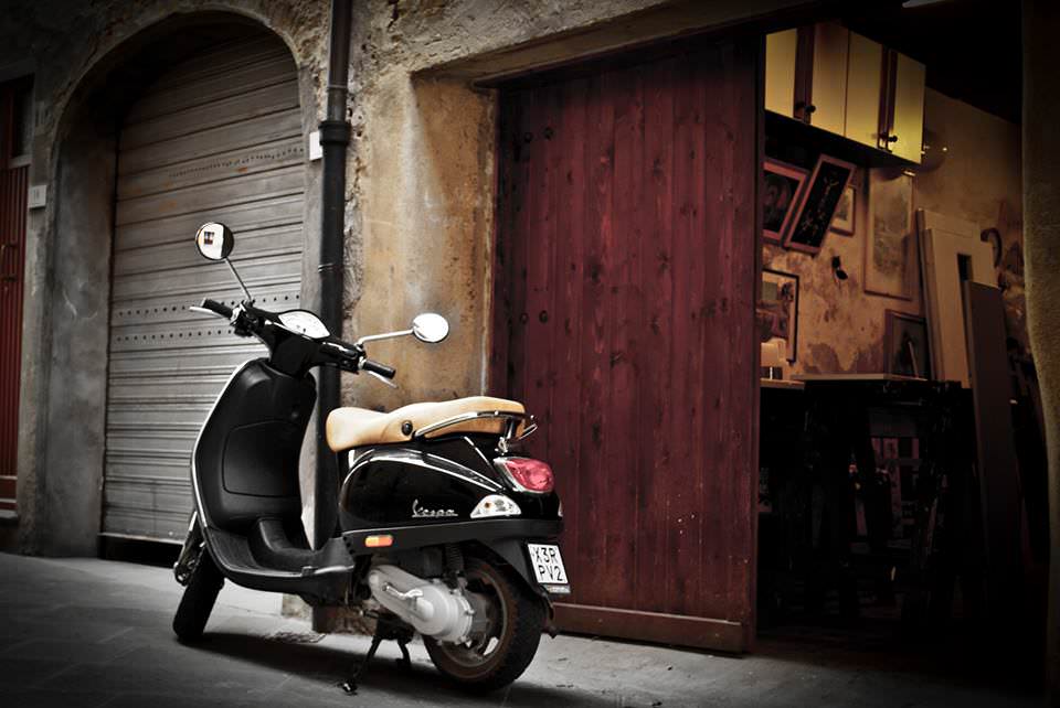A vespa in the medieval village of Peccioli