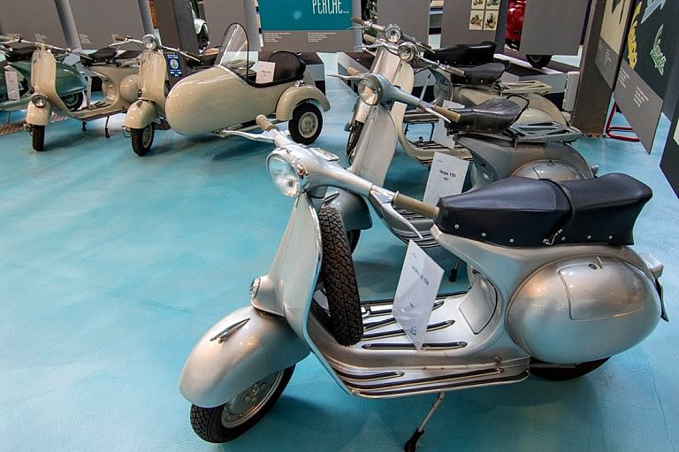 A series of Vespa models from the 50s and 60s