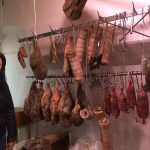 Moira surrounded by salami, pancetta and prosciutto