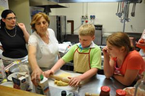 Children making a cake with Ester