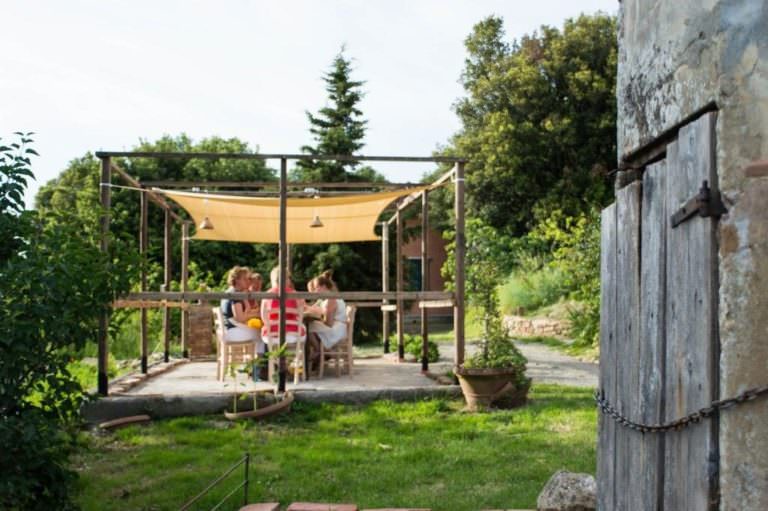 Relaxing dinner at sunset in the veranda of the farm