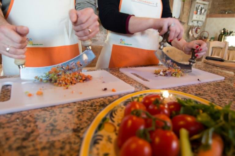 Chopping vegetables with the typical Mezzaluna