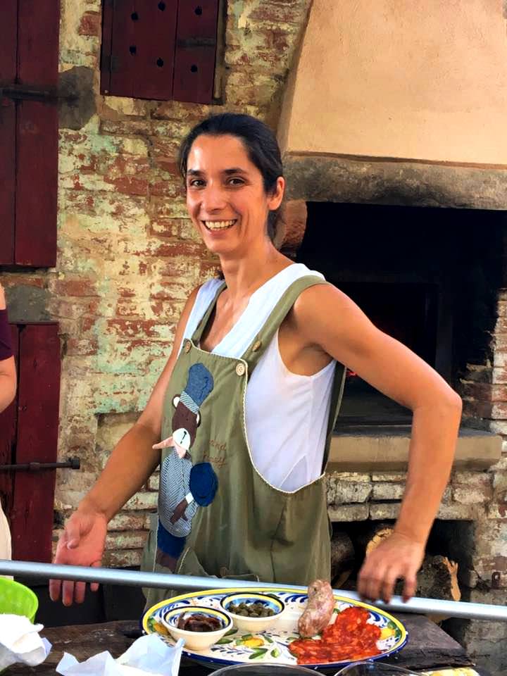 Our charming Rita baking delicious Pizzas