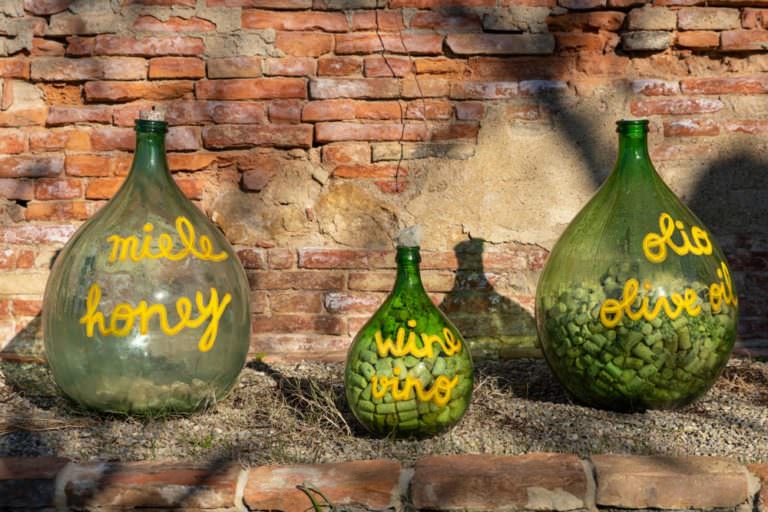 Damigiana bottles at the entrance