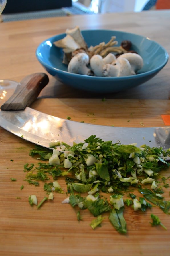 Mezzaluna knife and battuto with parsley and garlic