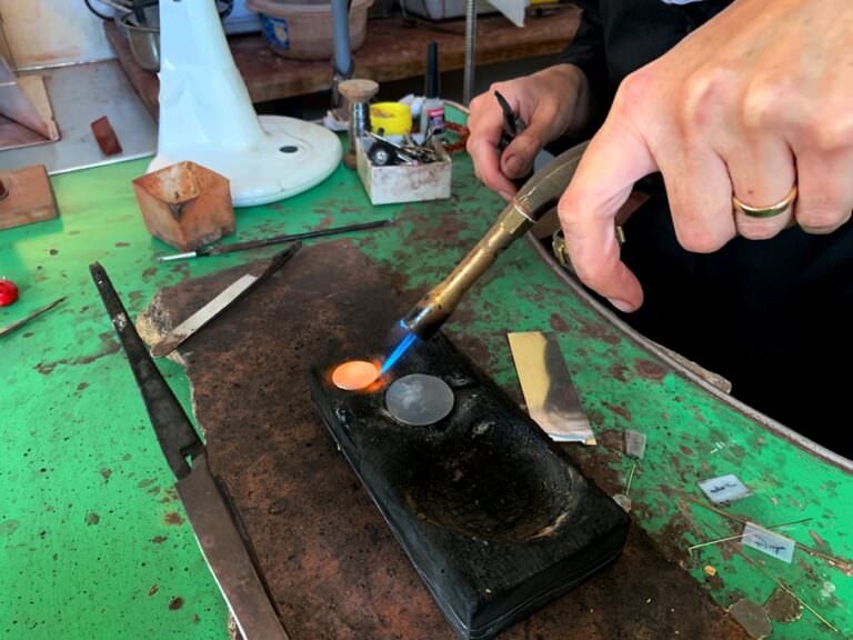 In order to soften metal a blowtorch is used by the jeweller