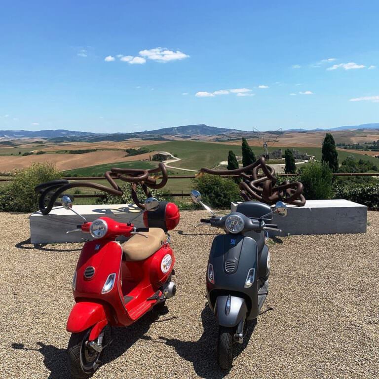 Riding vespa thorugh the Tuscan hills