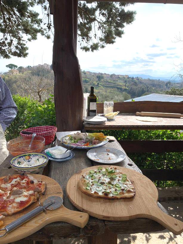 Preparing assorted Pizzas