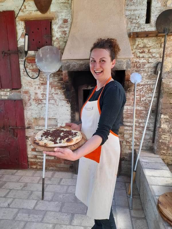 Delicious pizza baked in the wood burning oven