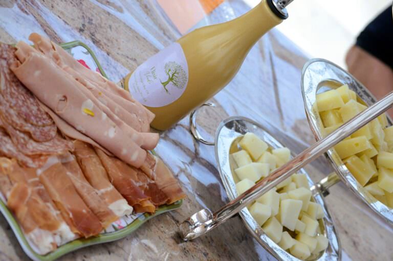 Cheese and salami served during the paint and palate experience near Peccioli