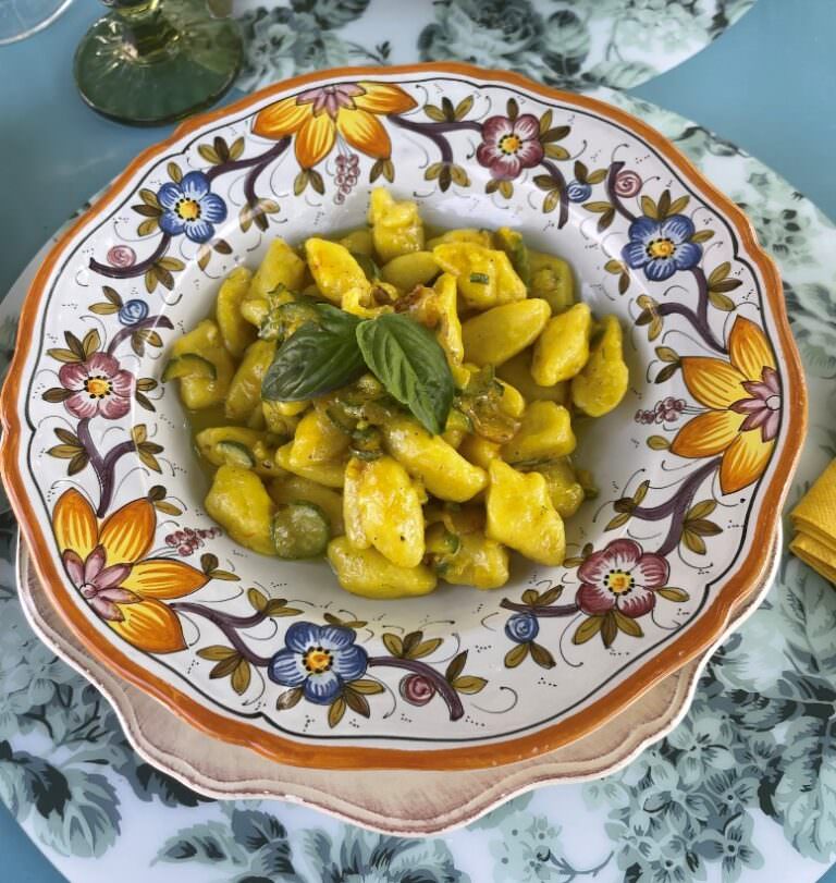 Tasting of potato gnocchi with vegetarian sauce