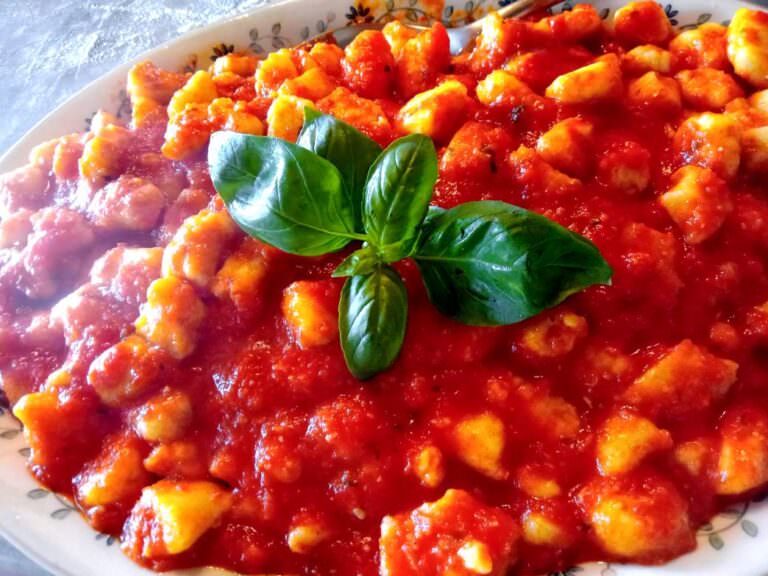 Typical gnocchi served with a tomato sauce and basil